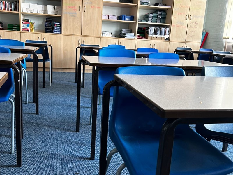 An empty classroom set up for a lesson