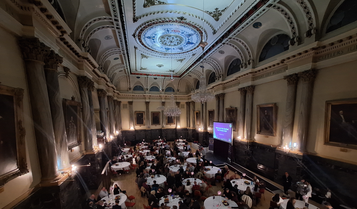 View from the balcony in Cutlers Hall, showing the tables set out for the awards and the stage and screen 
