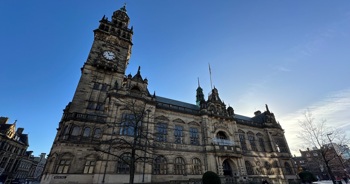 Sheffield Town Hall stands below a blue sky