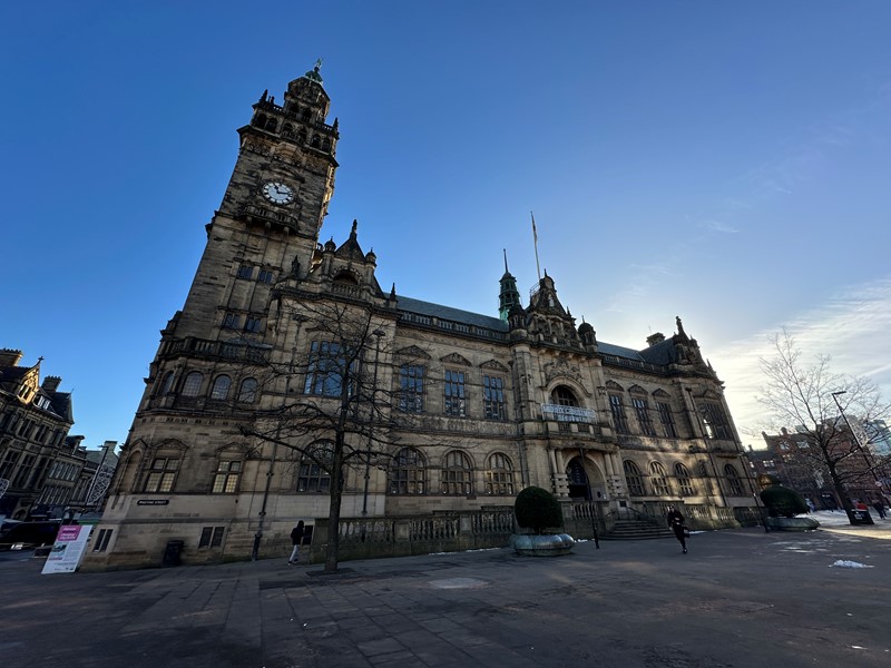 Sheffield Town Hall stands under a bright blue sky