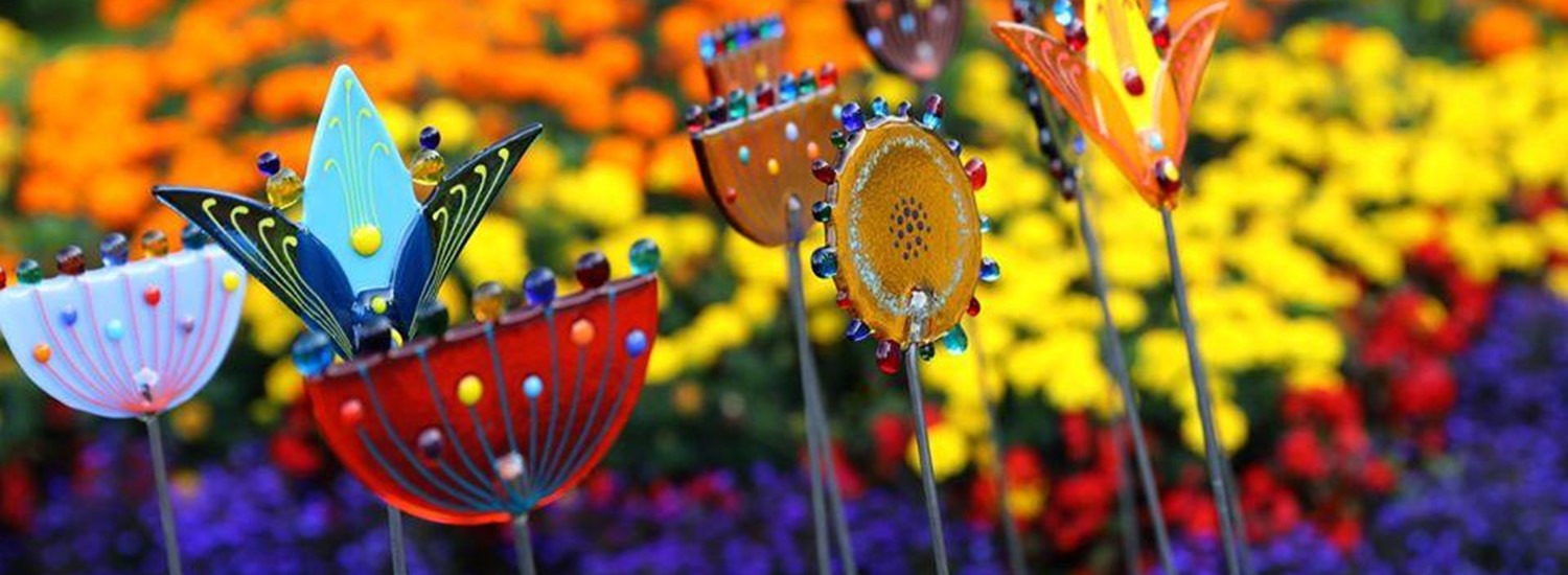 Art flowers in front of real flowers
