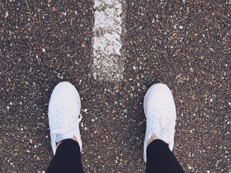 Pair of feet on a pavement