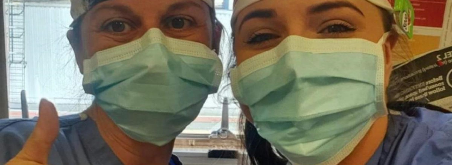 Two health workers in PPE