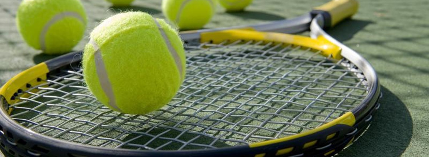 tennis balls on a racquet