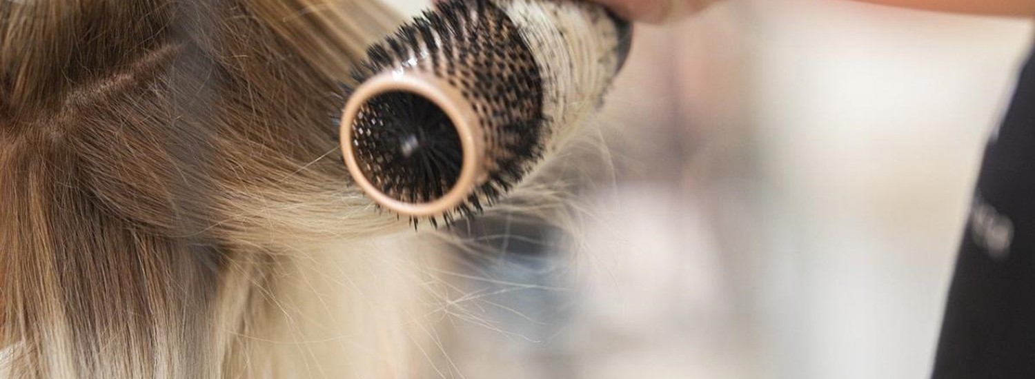 hair curling around a roller