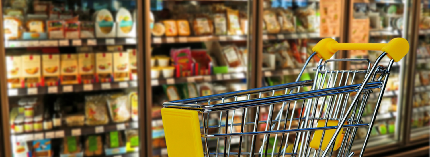 Shopping trolley and shelves in a shop