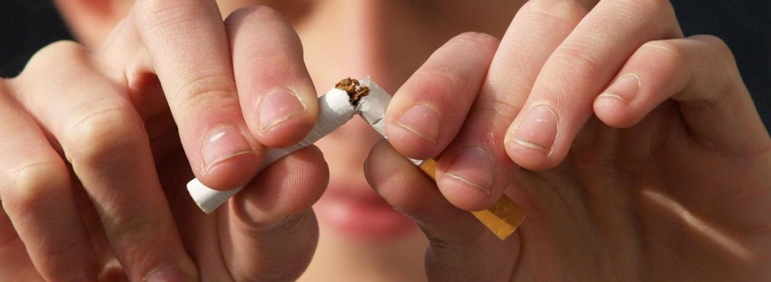 Close up of a man snapping a cigarette