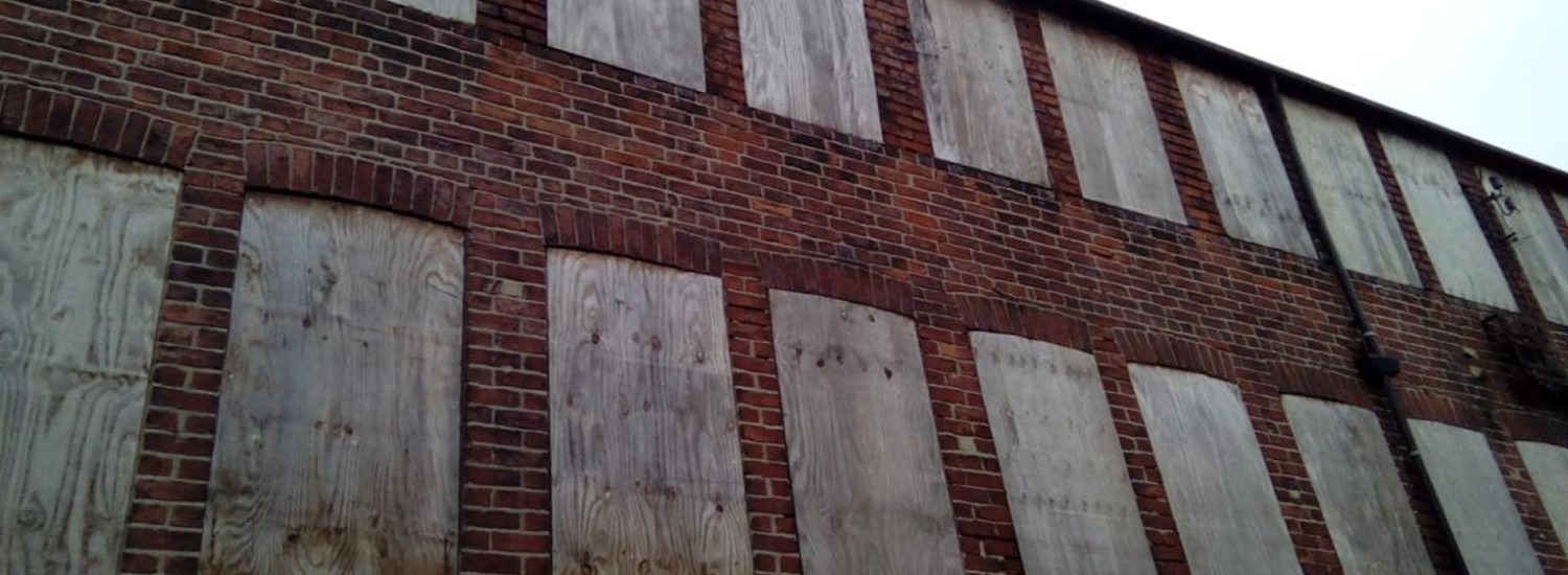 Boarded up windows at Leah's Yard