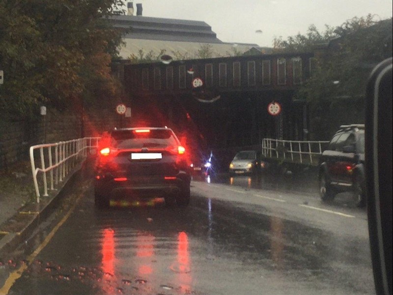 car travelling along flooded road