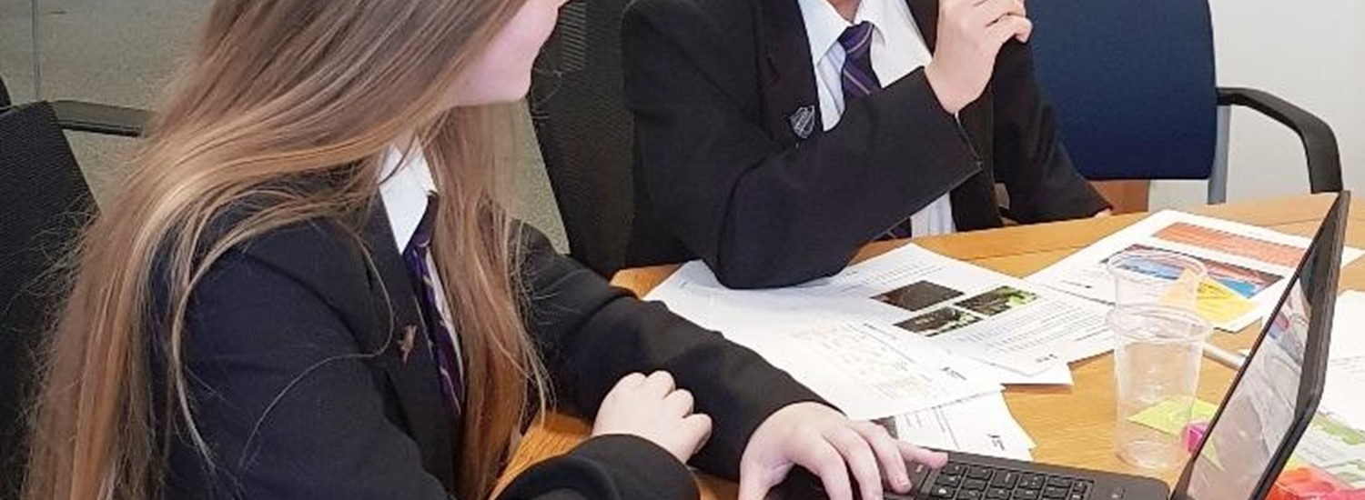 Two school girls at a desk