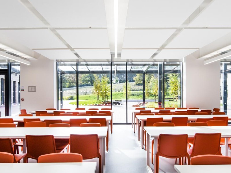 A classroom with seats facing a window
