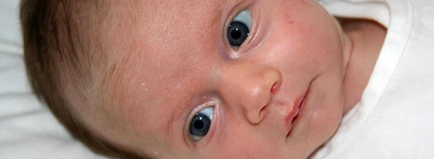 newborn baby with blue eyes