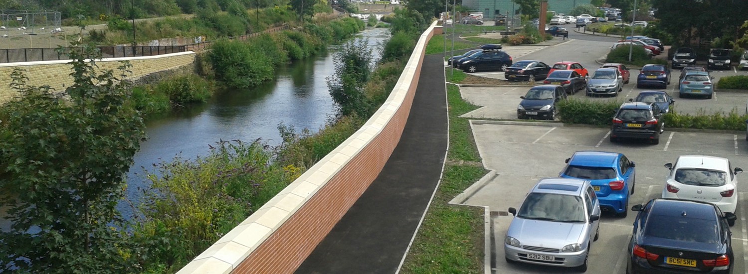 Road with cars next to a river in Sheffield