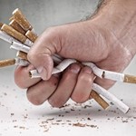 hand crushing cigarettes