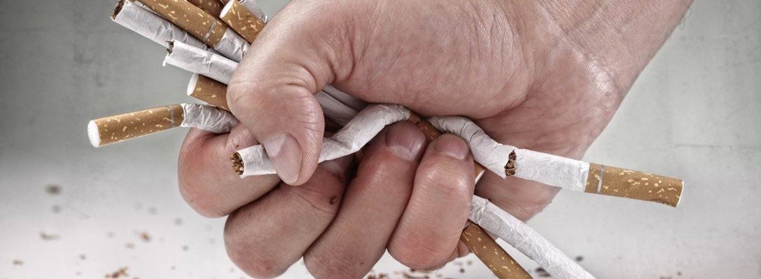hand crushing cigarettes