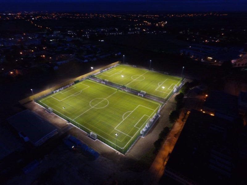 Football pitch from above lit at night