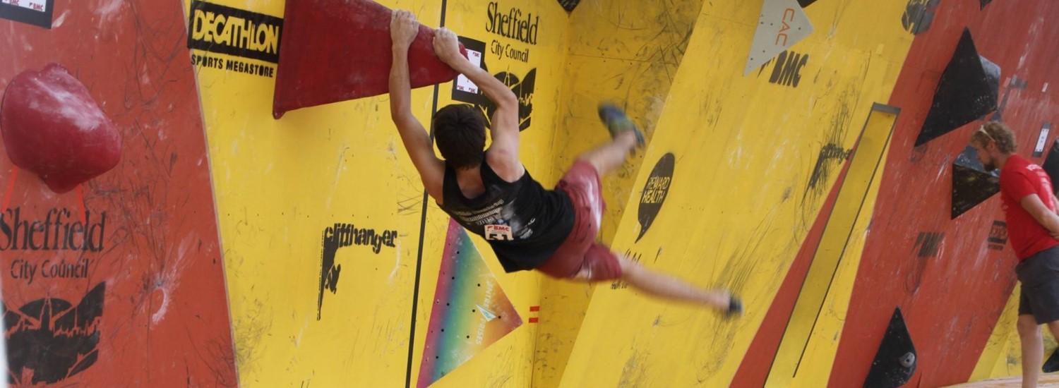 Man on an indoor climbing wall